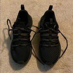 Women’s black Puma sneakers